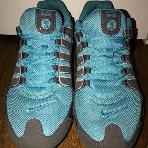 Blue and gray Nike Shox